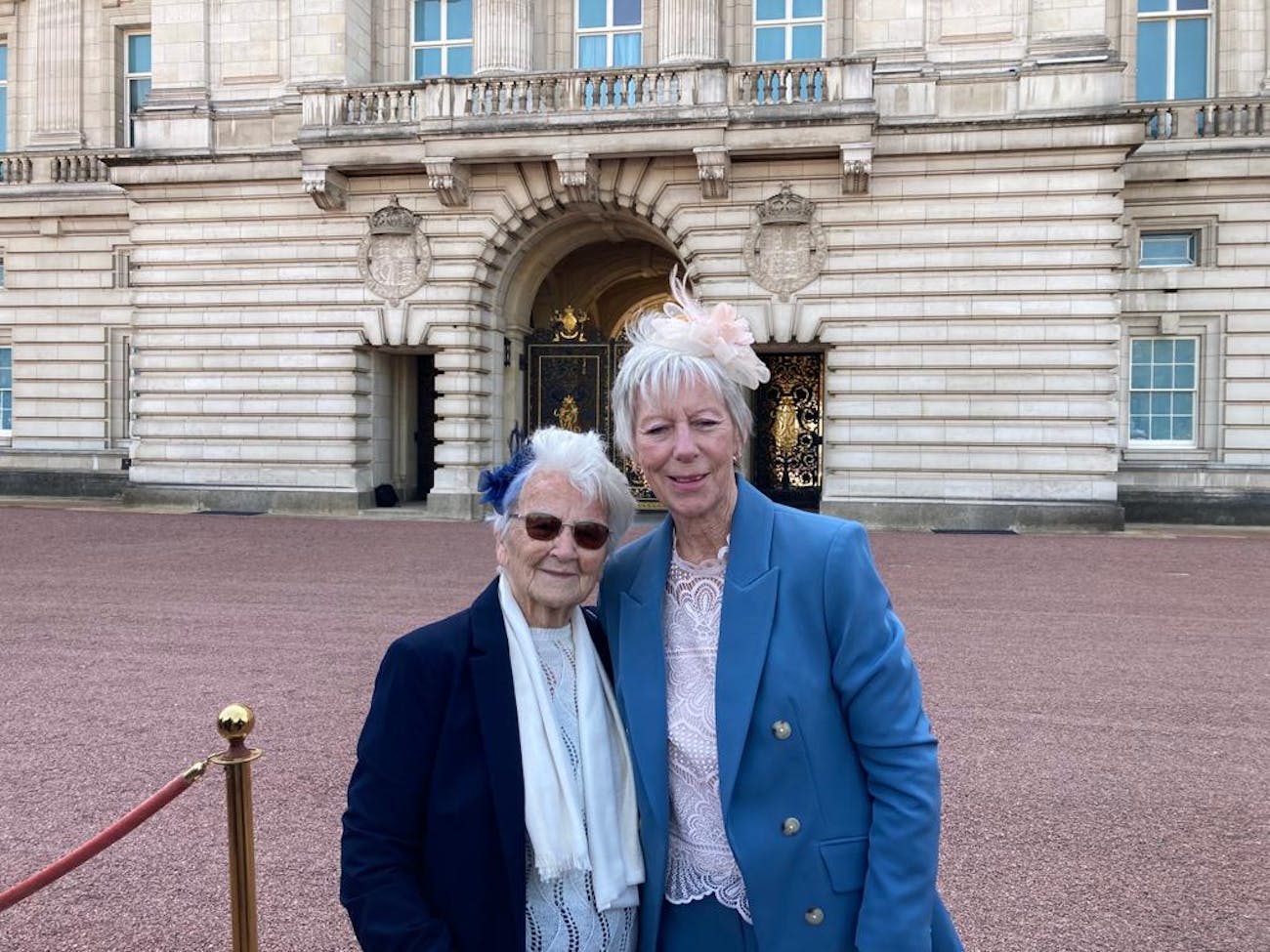 Margaret and Tricia attending a garden party at Buckingham Palace.